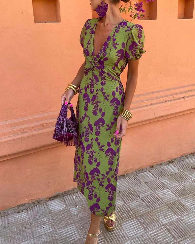 Elegant A-line dress with leaf print, deep V-neck, and puff sleeves