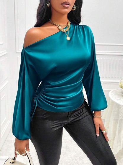 Women's asymmetrical long-sleeved satin blouse with a slanted neckline