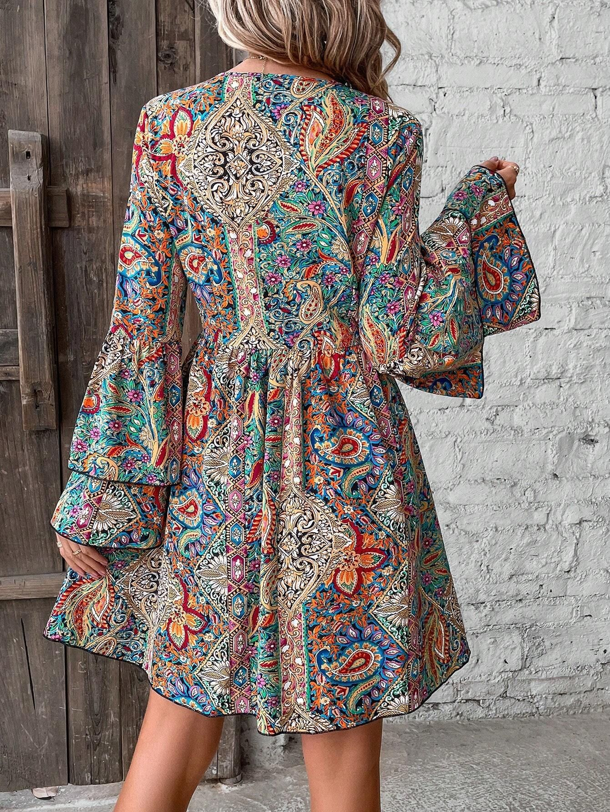 Bohemian dress with paisley and floral patterns, bell sleeves