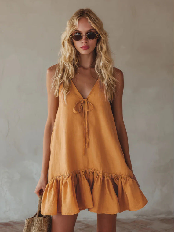 Mini-robe en lin à bretelles fines avec nœud sur le devant, couleur moutarde