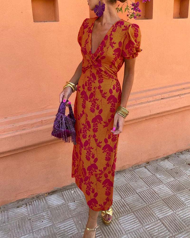 Elegant A-line dress with leaf print, deep V-neck, and puff sleeves
