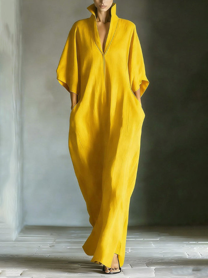 Robe longue élégante à col montant et manches chauve-souris