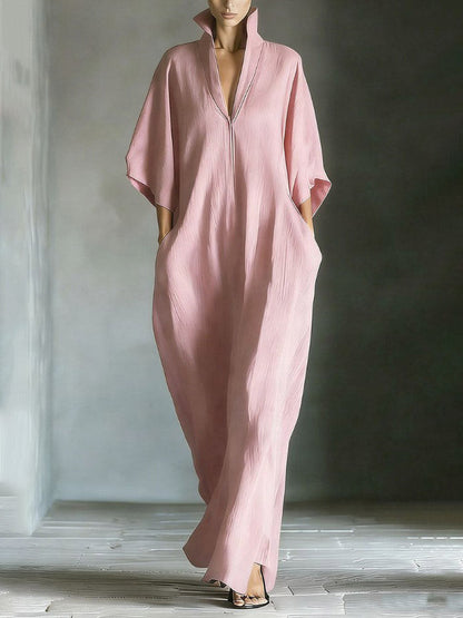 Robe longue élégante à col montant et manches chauve-souris