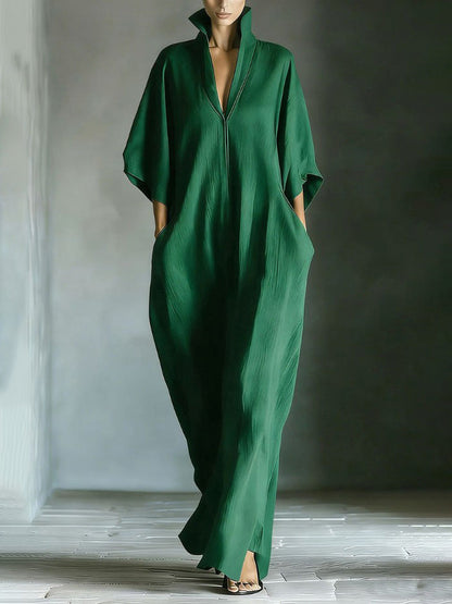 Robe longue élégante à col montant et manches chauve-souris