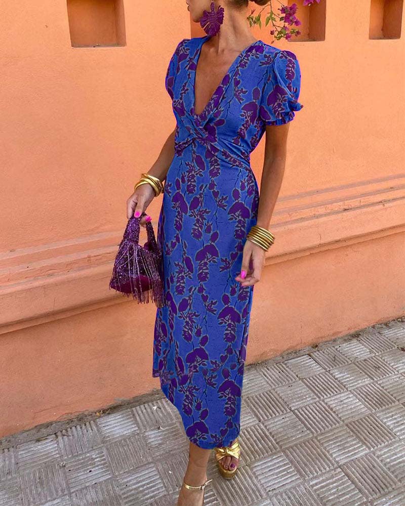 Elegant A-line dress with leaf print, deep V-neck, and puff sleeves