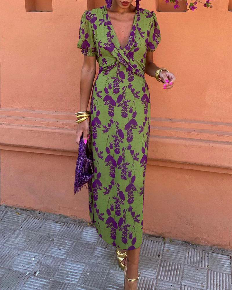 Elegant A-line dress with leaf print, deep V-neck, and puff sleeves
