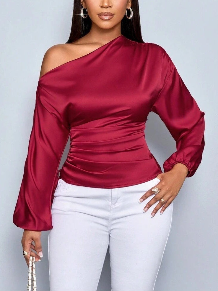 Women's asymmetrical long-sleeved satin blouse with a slanted neckline