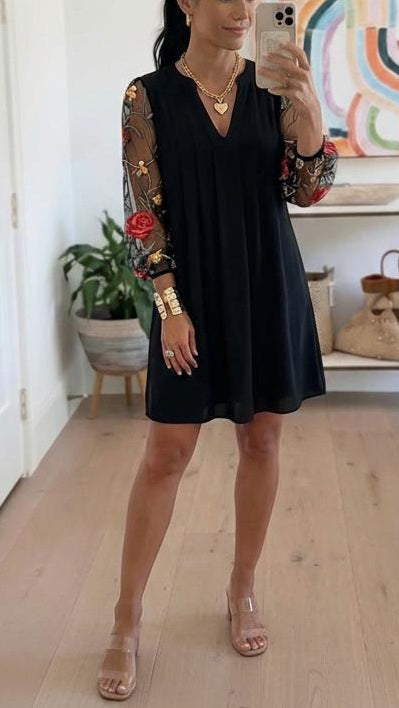 Elegant V-neck mini dress with sheer sleeves