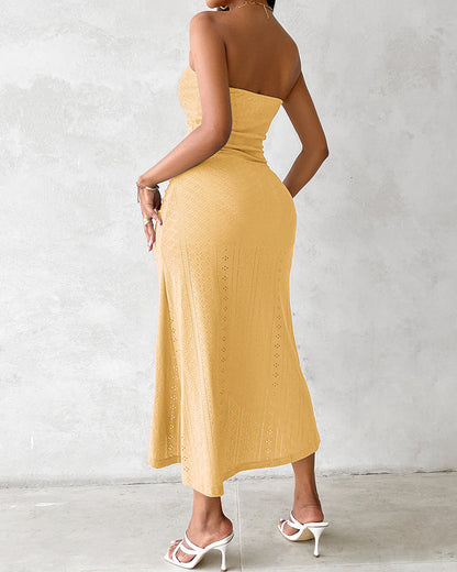 Sleeveless ruched vacation dress with a cinched waist, a draped bandeau-style bodice, eyelet embroidery, a slit, and an asymmetrical hem