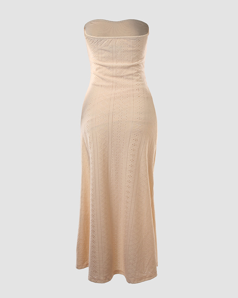 Sleeveless ruched vacation dress with a cinched waist, a draped bandeau-style bodice, eyelet embroidery, a slit, and an asymmetrical hem