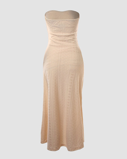 Sleeveless ruched vacation dress with a cinched waist, a draped bandeau-style bodice, eyelet embroidery, a slit, and an asymmetrical hem