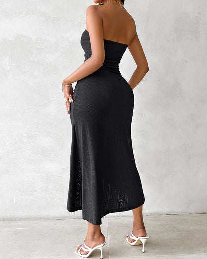 Sleeveless ruched vacation dress with a cinched waist, a draped bandeau-style bodice, eyelet embroidery, a slit, and an asymmetrical hem