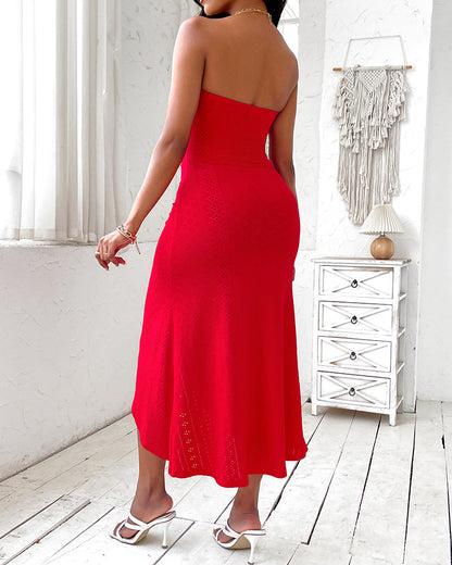 Sleeveless ruched vacation dress with a cinched waist, a draped bandeau-style bodice, eyelet embroidery, a slit, and an asymmetrical hem