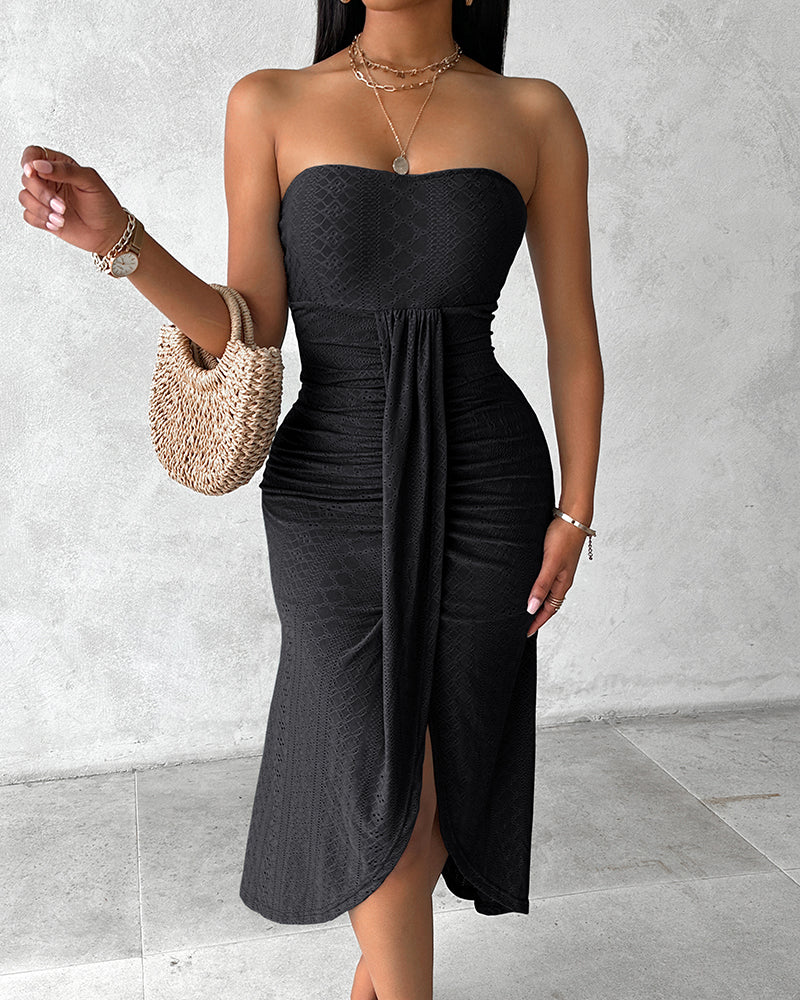 Sleeveless ruched vacation dress with a cinched waist, a draped bandeau-style bodice, eyelet embroidery, a slit, and an asymmetrical hem