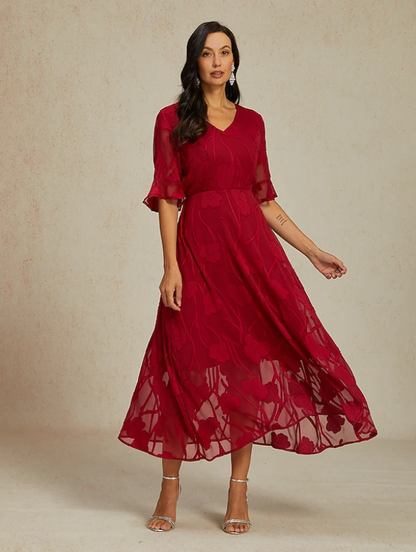 Robe florale col V à manches transparentes