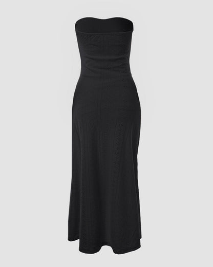 Sleeveless ruched vacation dress with a cinched waist, a draped bandeau-style bodice, eyelet embroidery, a slit, and an asymmetrical hem