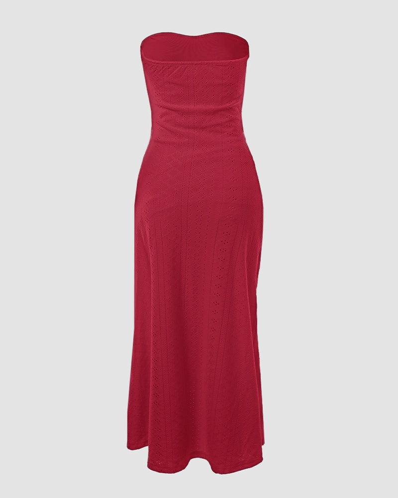 Sleeveless ruched vacation dress with a cinched waist, a draped bandeau-style bodice, eyelet embroidery, a slit, and an asymmetrical hem