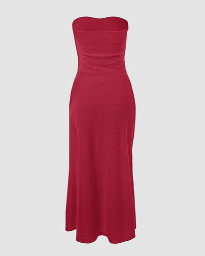 Sleeveless ruched vacation dress with a cinched waist, a draped bandeau-style bodice, eyelet embroidery, a slit, and an asymmetrical hem