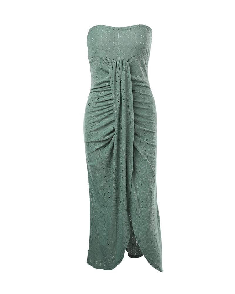 Sleeveless ruched vacation dress with a cinched waist, a draped bandeau-style bodice, eyelet embroidery, a slit, and an asymmetrical hem
