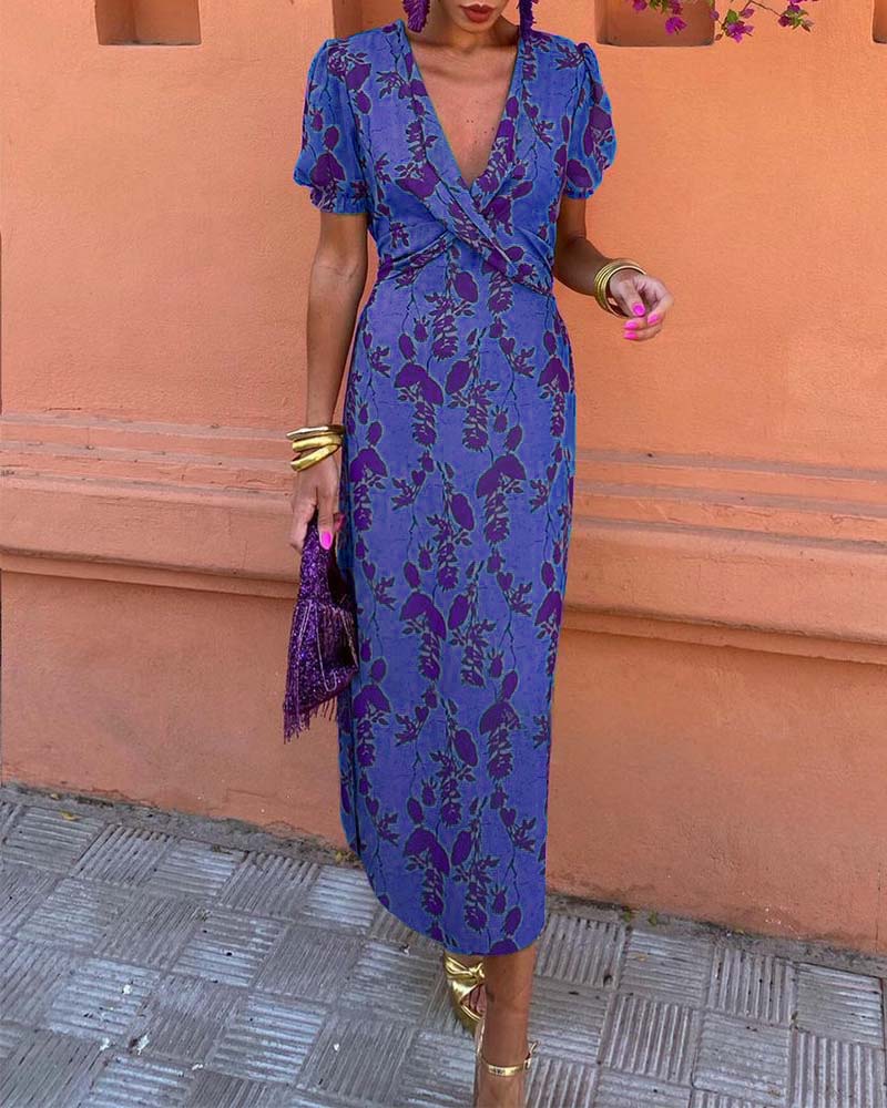 Elegant A-line dress with leaf print, deep V-neck, and puff sleeves
