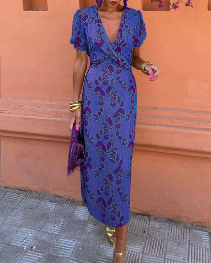 Elegant A-line dress with leaf print, deep V-neck, and puff sleeves