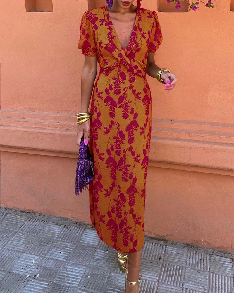 Elegant A-line dress with leaf print, deep V-neck, and puff sleeves