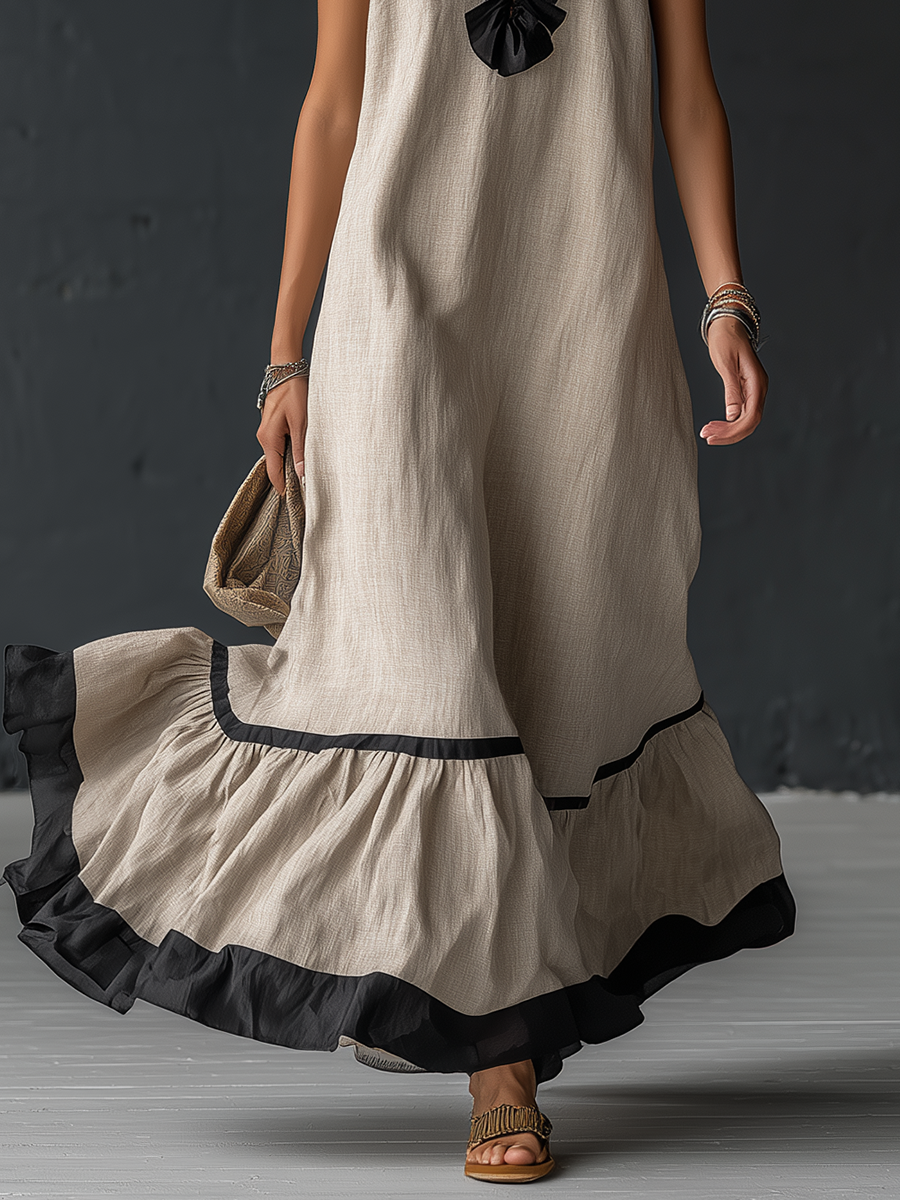 Élégante robe longue en coton et lin, sans manches, avec encolure en V, volants et blocs de couleurs.