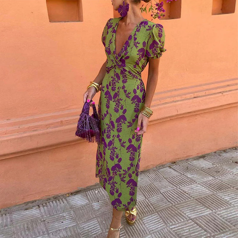 Elegant A-line dress with leaf print, deep V-neck, and puff sleeves