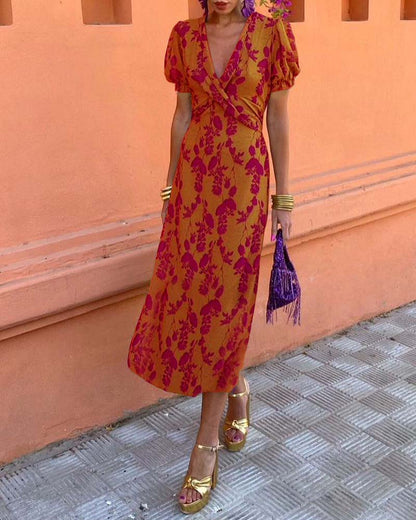 Elegant A-line dress with leaf print, deep V-neck, and puff sleeves