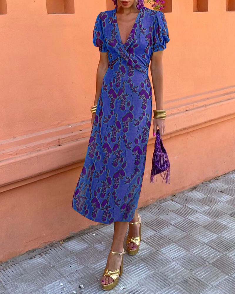 Elegant A-line dress with leaf print, deep V-neck, and puff sleeves