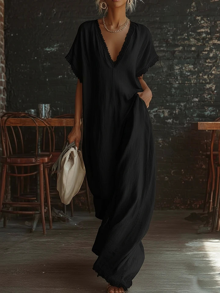 Urban white cotton maxi dress with a V-neck, short sleeves, and lace trim, casual bohemian style