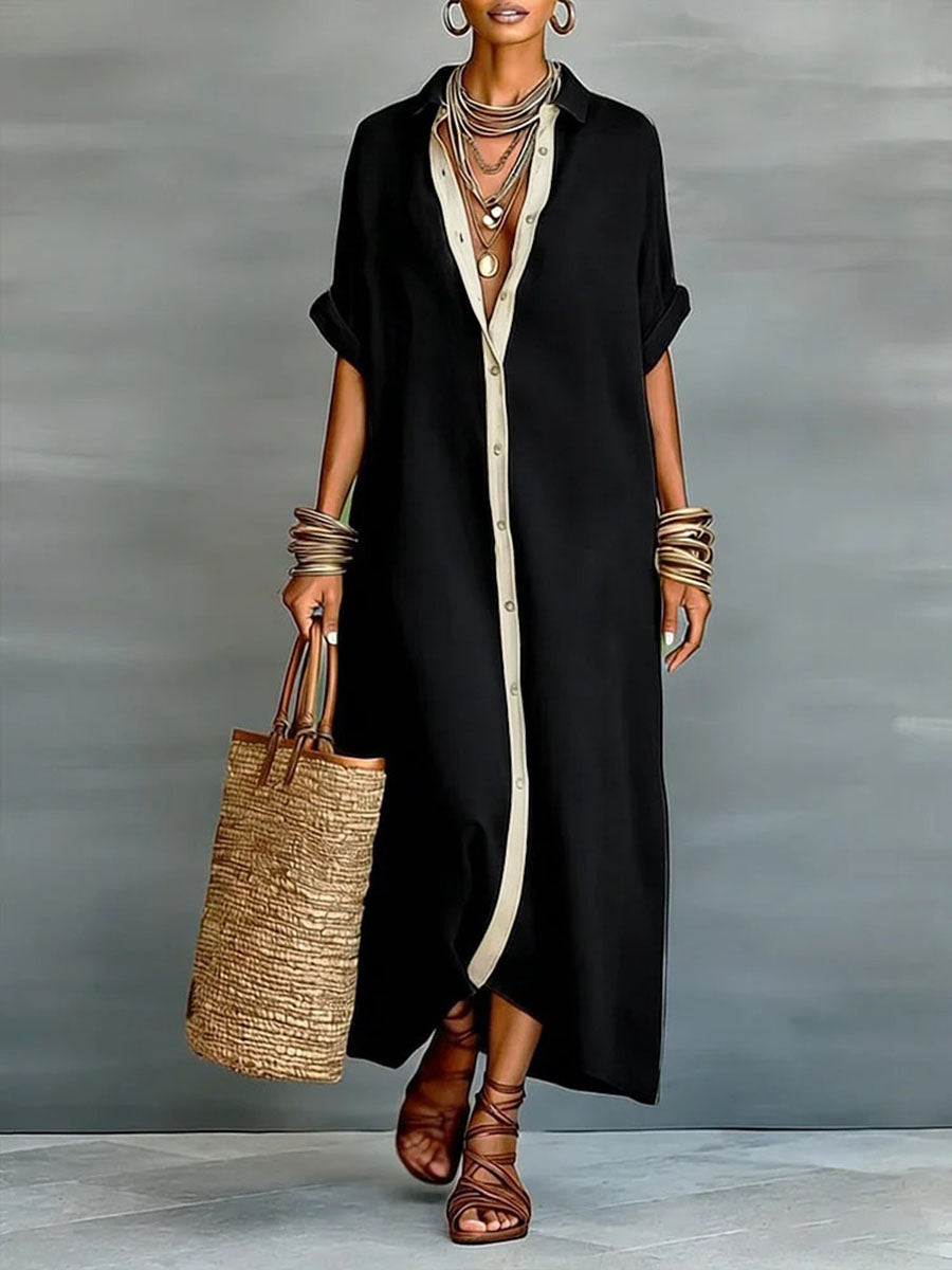 Long dress with lapels, short ample sleeves, with buttons, pockets and slit seams