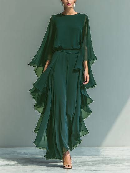 Women's set consisting of a navy blue chiffon top with flared sleeves and straight pants with ruffled details