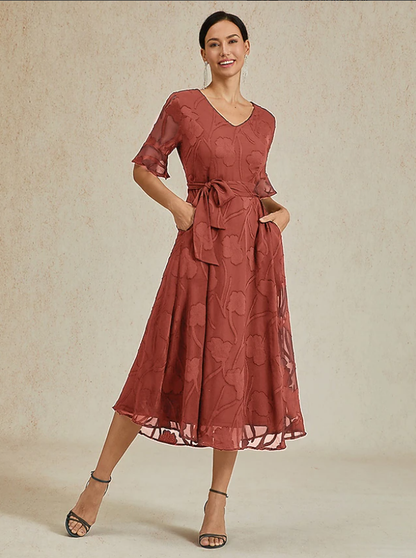 Robe florale col V à manches transparentes