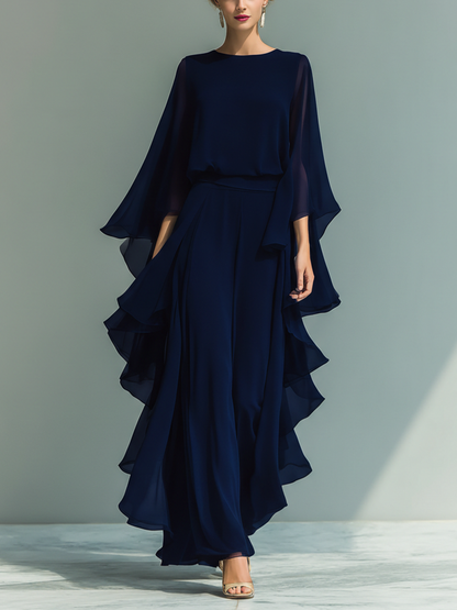 Women's set consisting of a navy blue chiffon top with flared sleeves and straight pants with ruffled details