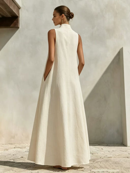 Robe longue ample sans manches en mélange de lin, avec col montant et poches