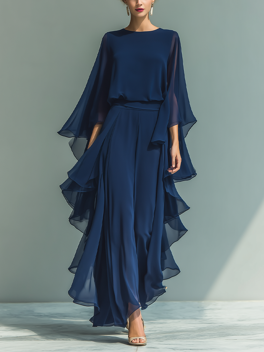 Women's set consisting of a navy blue chiffon top with flared sleeves and straight pants with ruffled details