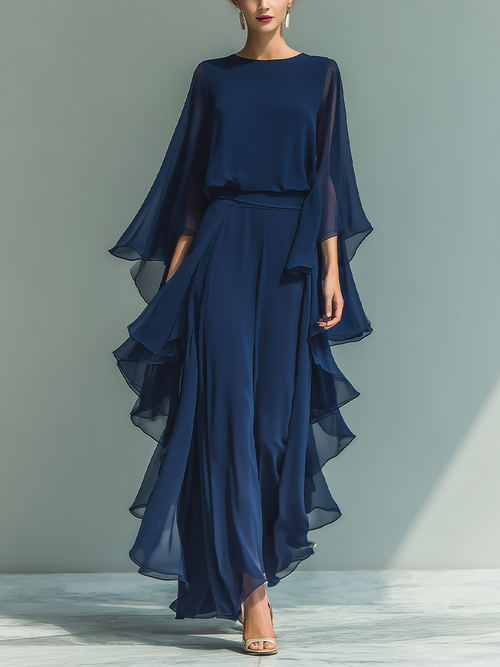 Women's set consisting of a navy blue chiffon top with flared sleeves and straight pants with ruffled details