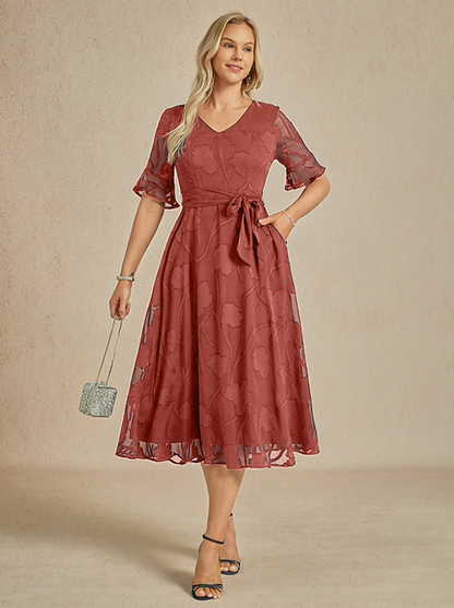 Robe florale col V à manches transparentes