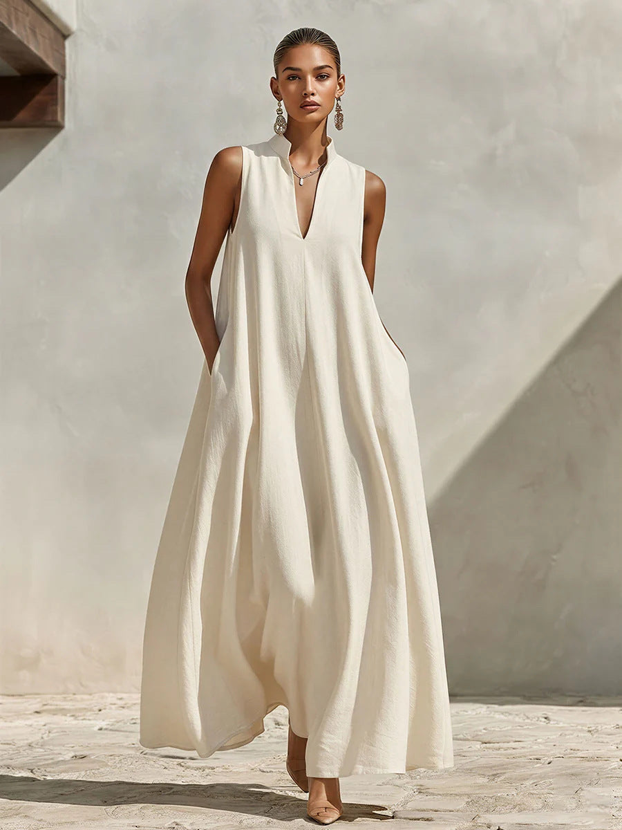 Robe longue ample sans manches en mélange de lin, avec col montant et poches