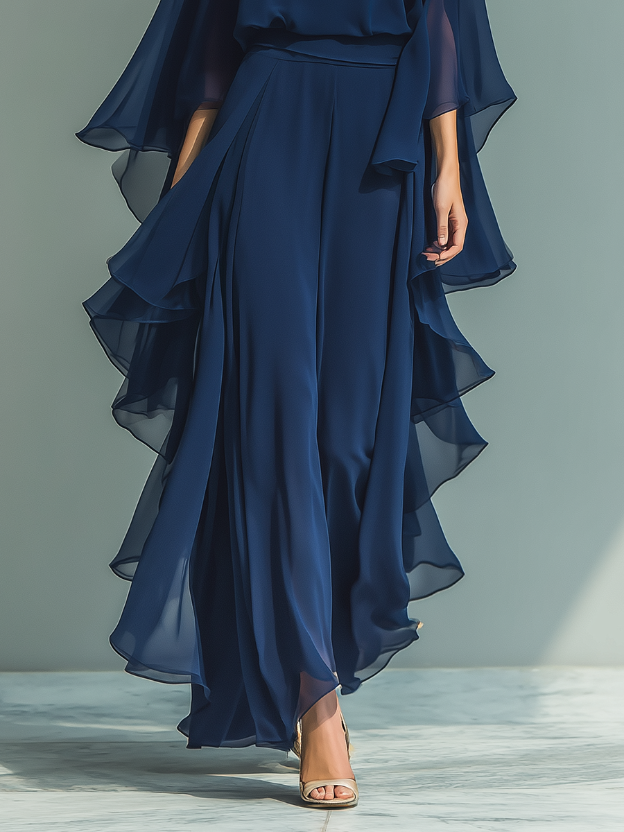 Women's set consisting of a navy blue chiffon top with flared sleeves and straight pants with ruffled details