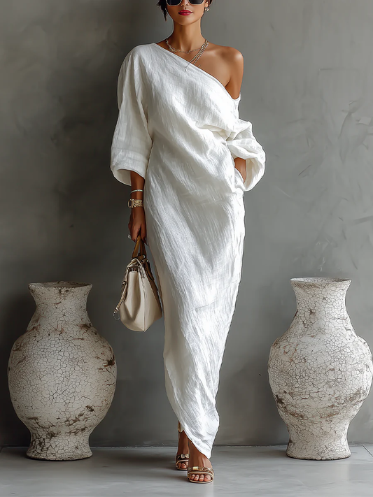 Elegant white one-shoulder maxi dress with flowing ruffles