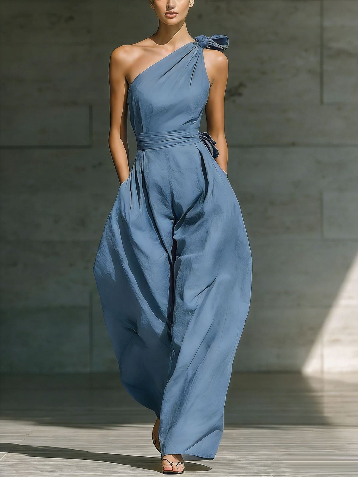 Asymmetric one-shoulder sleeveless jumpsuit with defined waist