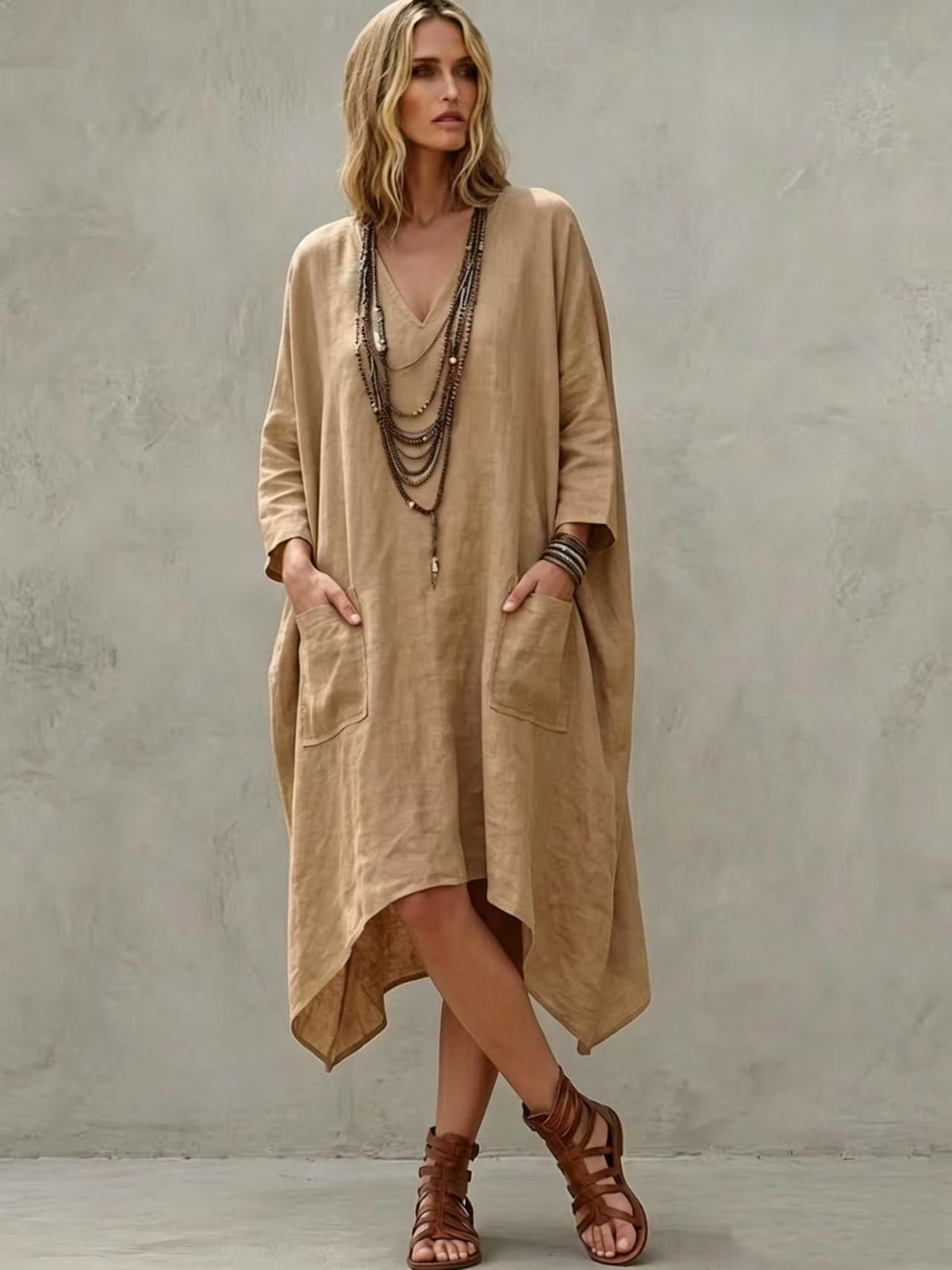 Robe midi en lin mélangé à col en V, manches 3/4, ourlet irrégulier et poches latérales