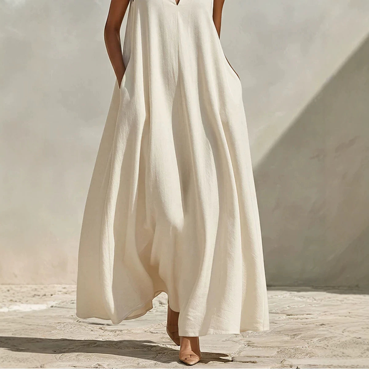 Robe longue ample sans manches en mélange de lin, avec col montant et poches