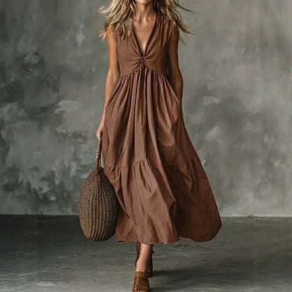 Robe longue texturée ample sans manches à col en V et devant torsadé avec poches