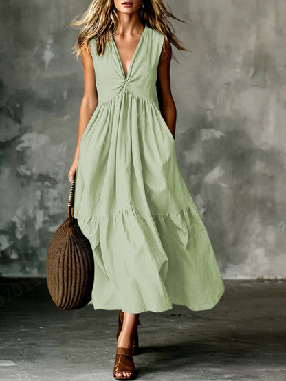 Robe longue texturée ample sans manches à col en V et devant torsadé avec poches