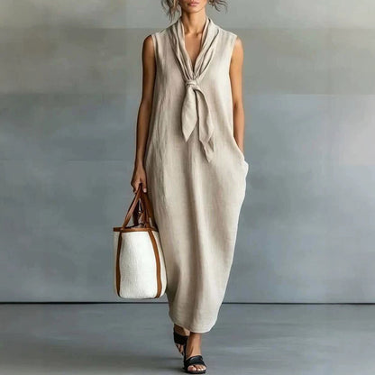 Robe trapèze mi-longue sans manches en lin beige naturel à nouer sur le devant
