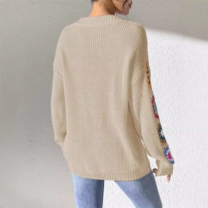 V-neck jumper with crochet flowers