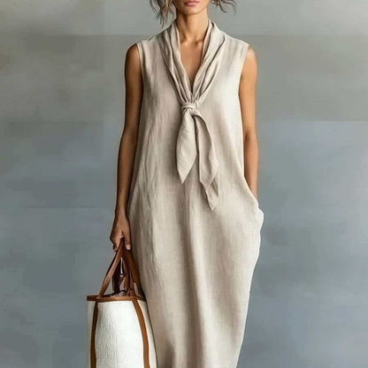 Robe trapèze mi-longue sans manches en lin beige naturel à nouer sur le devant